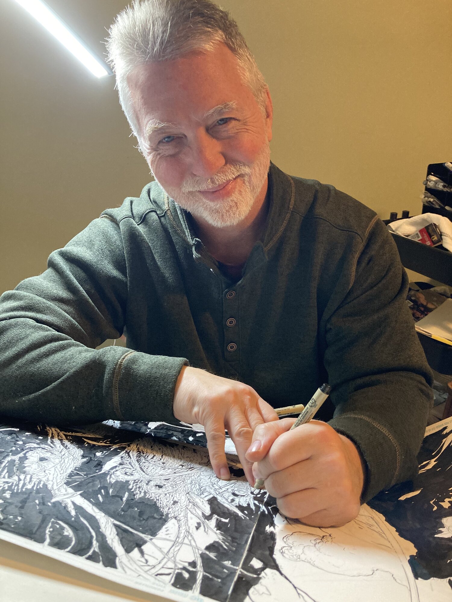 Doug Mahnke working at the drawing table